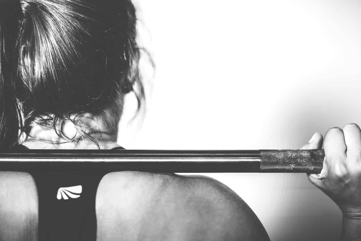 picture of a woman lifting weight