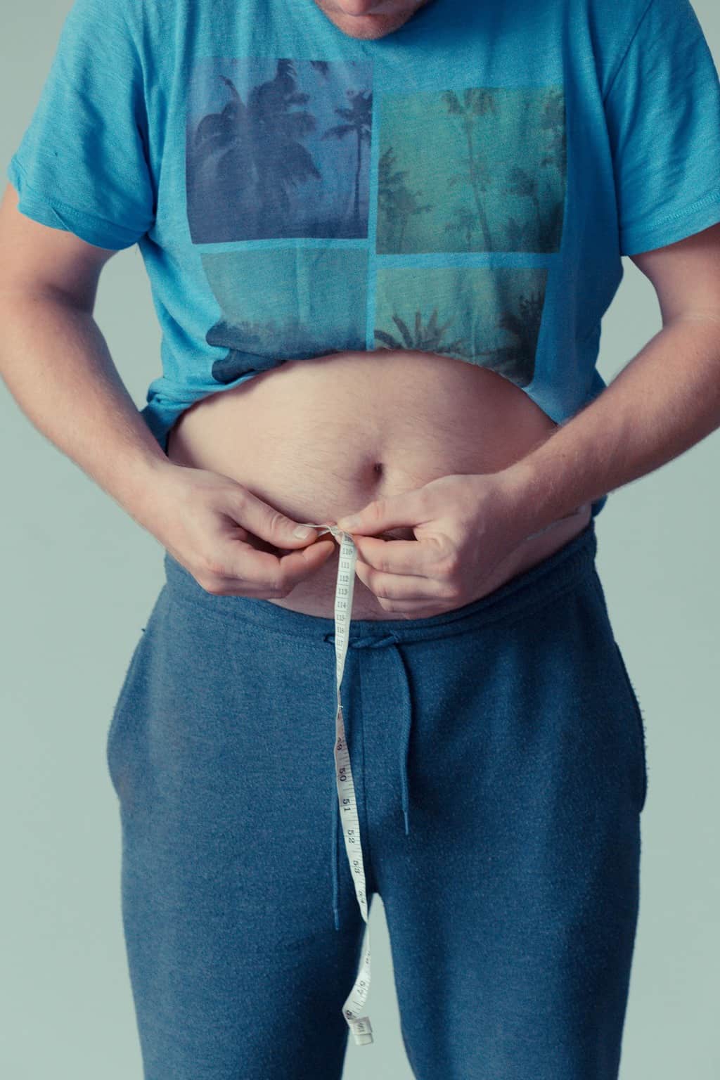 a man measuring his waist