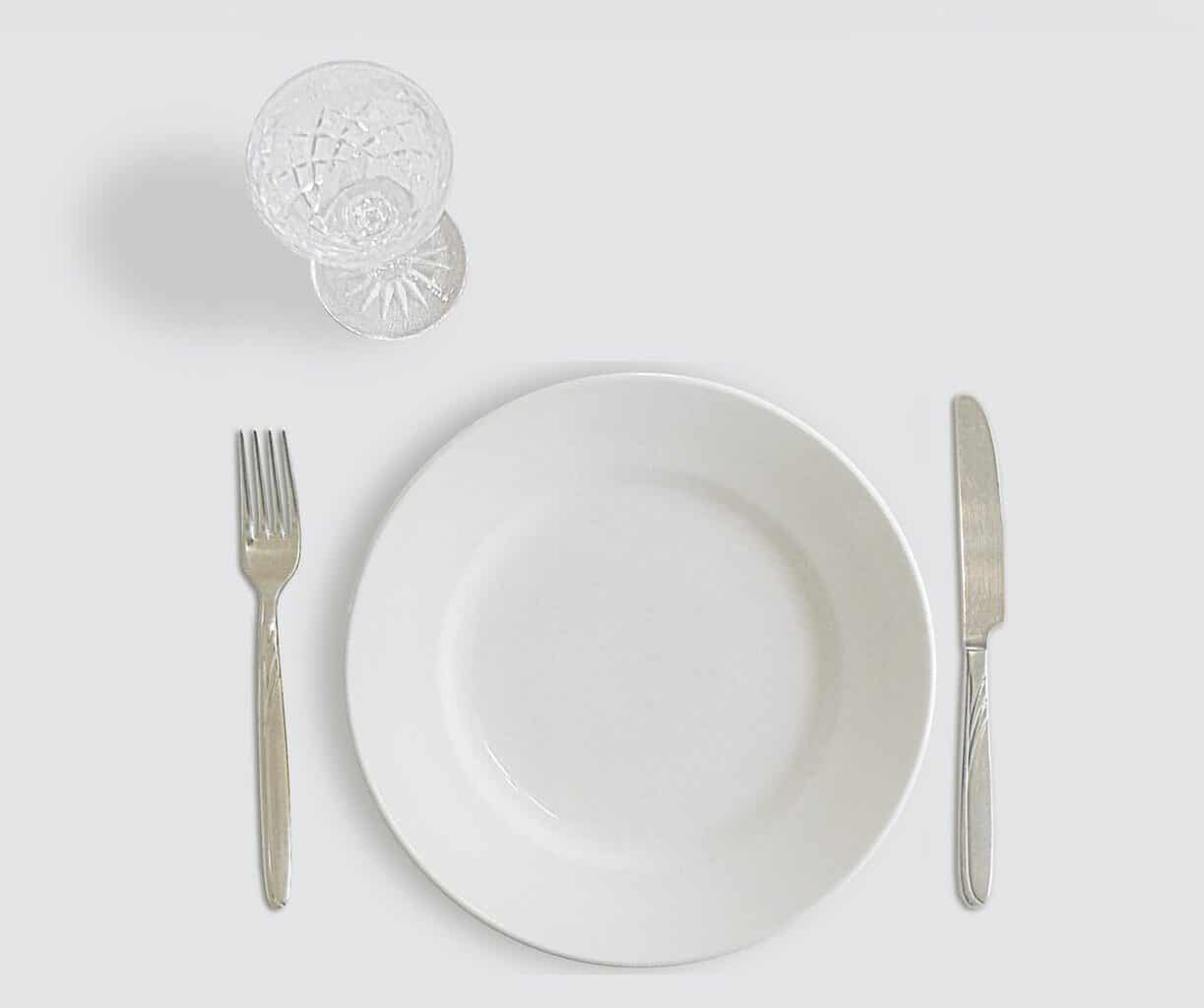 an empty glass and plate