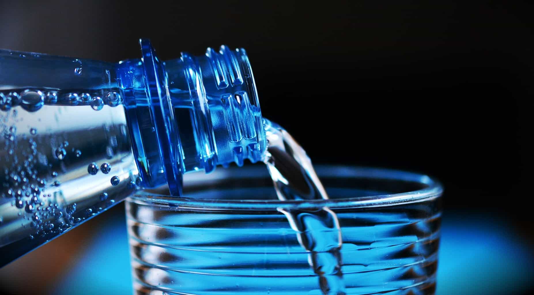 pouring water from bottle to a glass