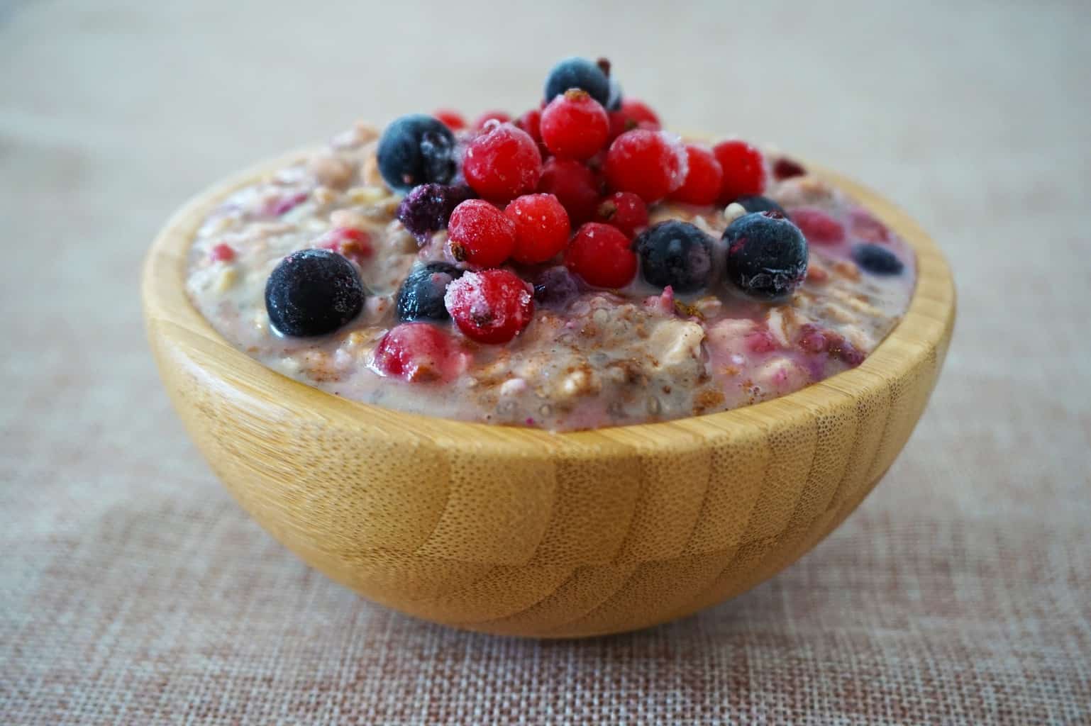 Overnight oats in a bowl with a topping of berries