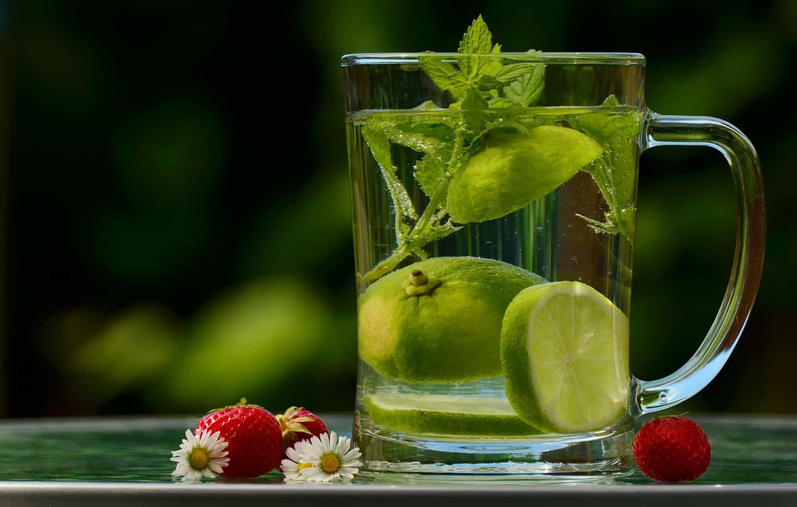 a cup of detox drink of lemon and mint